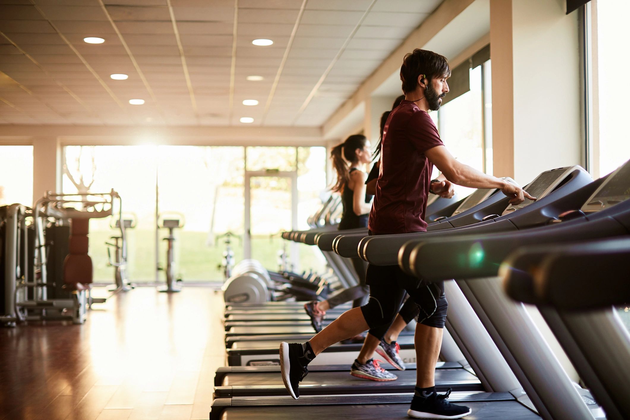 Members running on treadmills