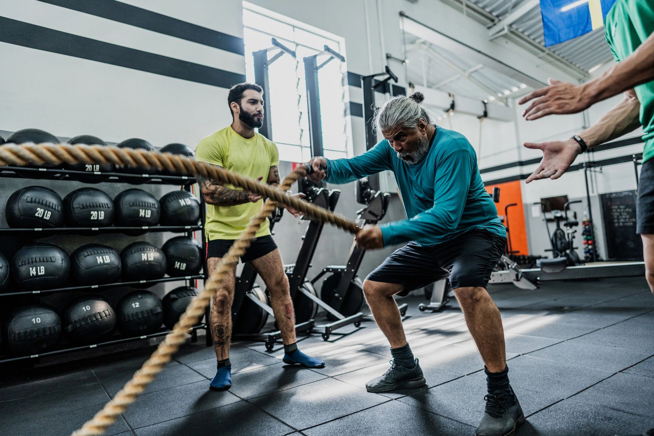 Coach guiding a client through gym training