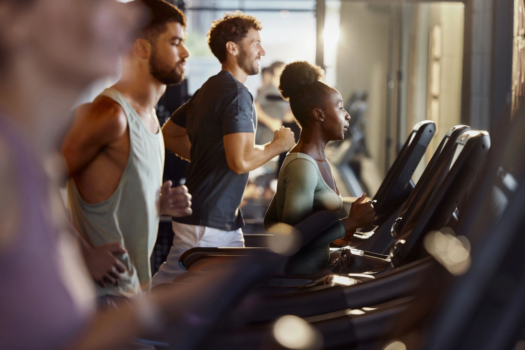 Athlete training on a treadmill in a modern gym