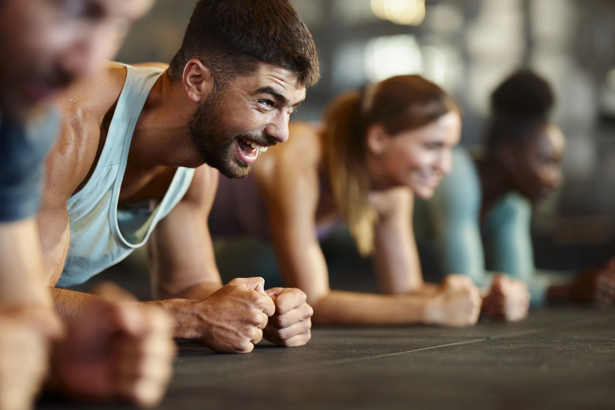 Members exercising together in a motivating gym environment